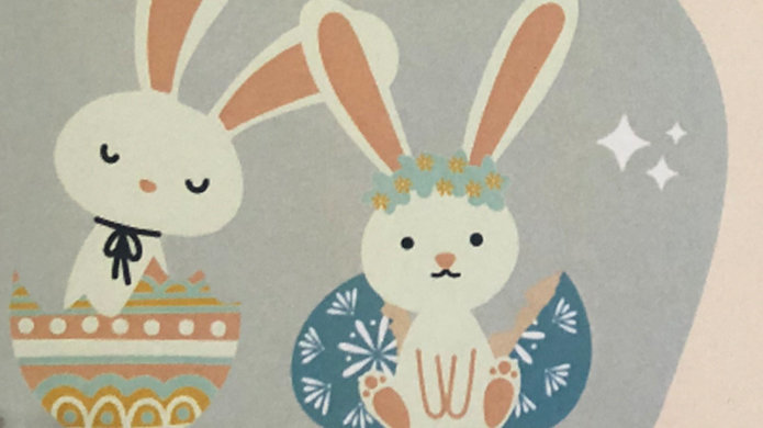 Two rabbits sitting with decorated eggs, cartoon illustration.