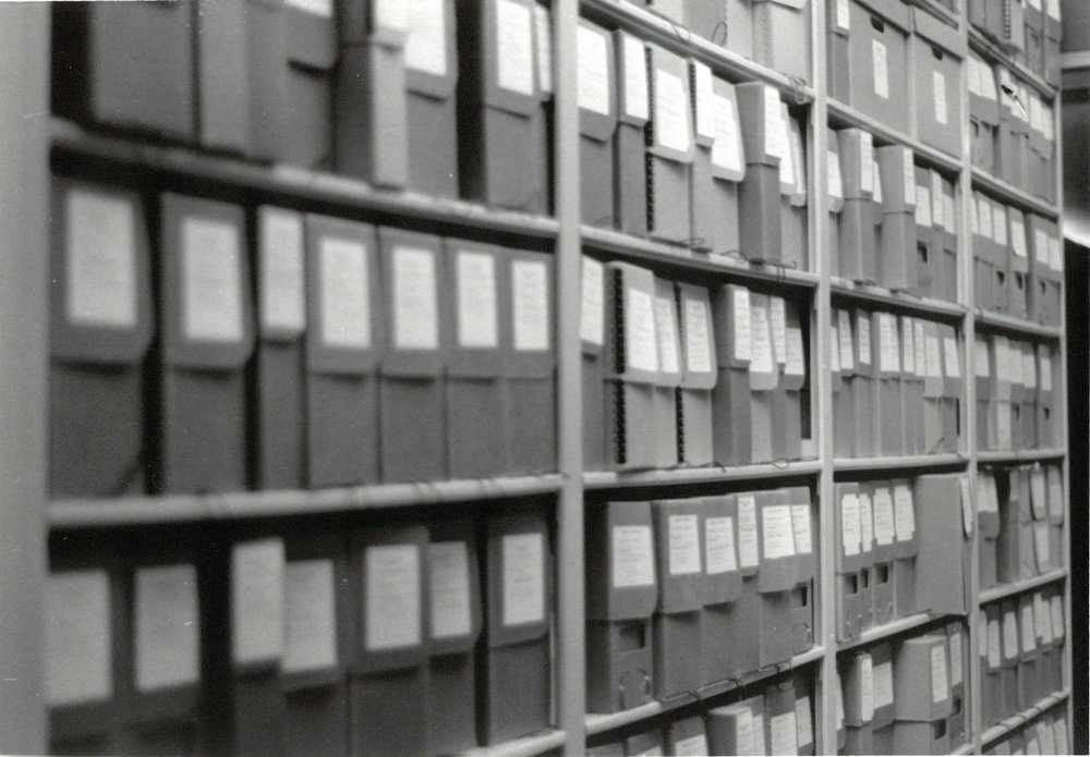 Archival boxes, black and white photo.