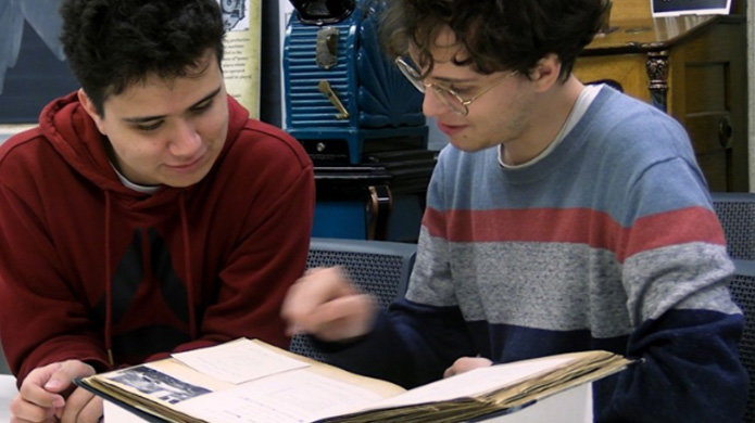 Two students using a primary resource